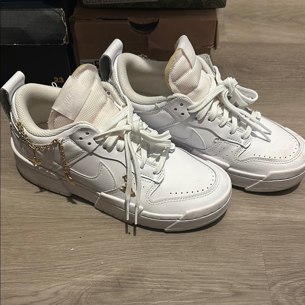 Nike White Sneakers with Gold Details